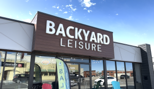 Backyard Leisure's Lethbridge storefront on a sunny day with a clear blue sky